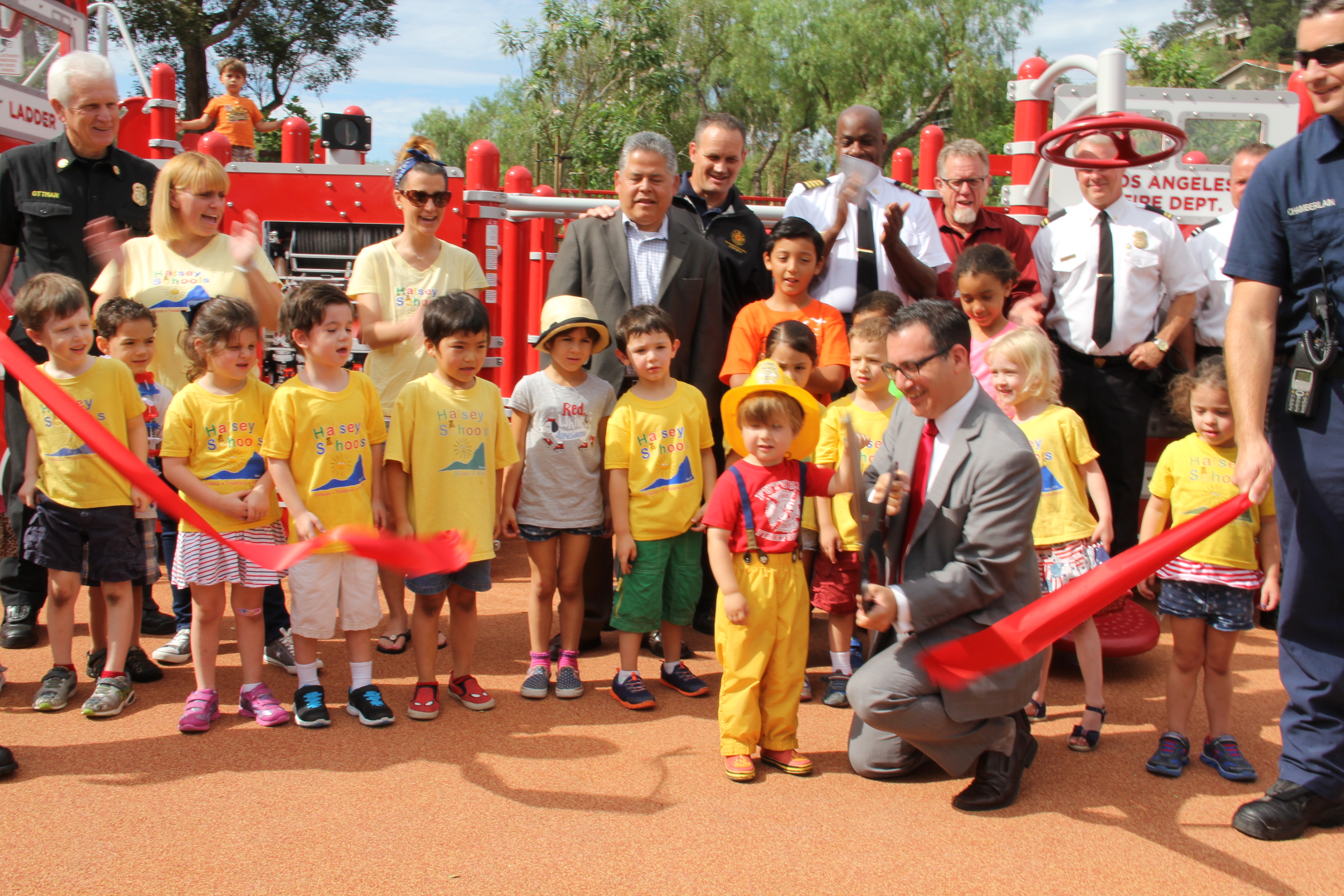 Blumenfield is joined by Recreation and Parks officials, LAFD Firefighters and dozens of neighbors and local kids to cut the ribbon on the new Costanso Fire Station 84 Park, on July 2, 2015.
